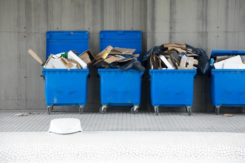 Workers segregating builders waste for recycling