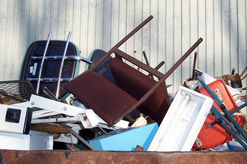 Man and van preparing to load a sofa for disposal